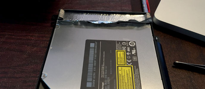 Peel tape off optical drive